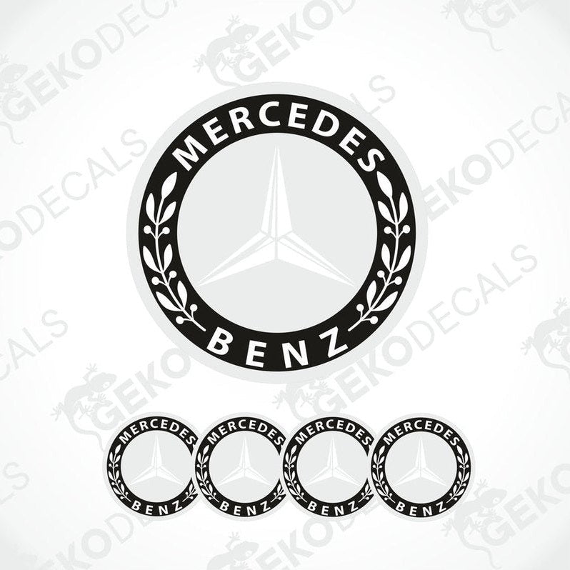 A set of four black and grey Mercedes-Benz wheel decals with a star logo in the center.