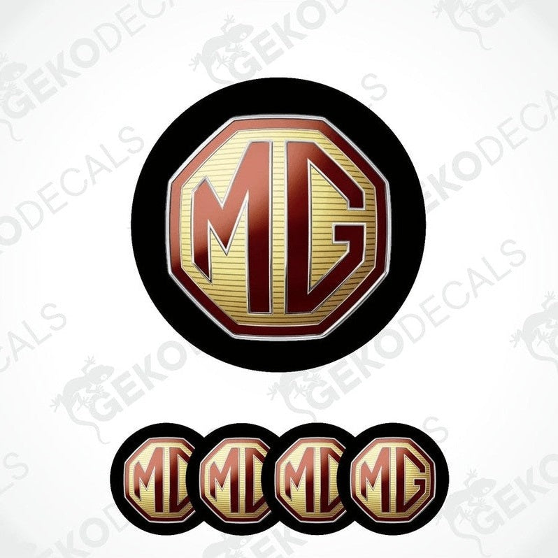 A set of decals with the letters 'MG' in a shield-like shape, predominantly in red and gold colors with a black background.