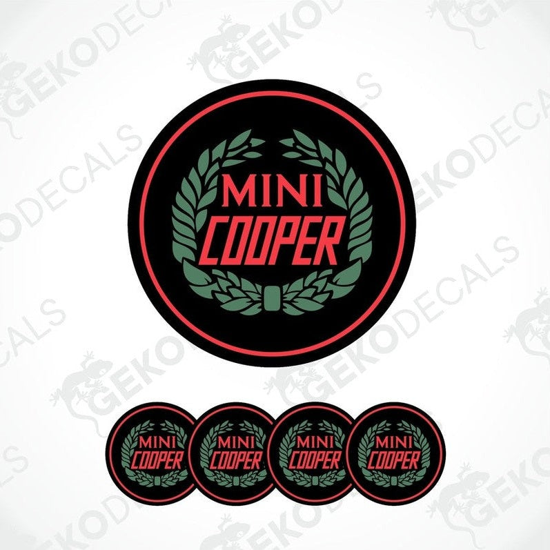 A set of four black, red, and green vinyl stickers with the text 'MINI COOPER' in the center.