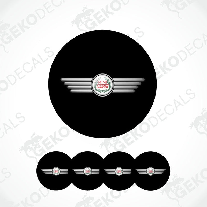 A set of black vinyl decals with a silver logo, designed for MINI COOPER vehicles, including four wheel cap decals.