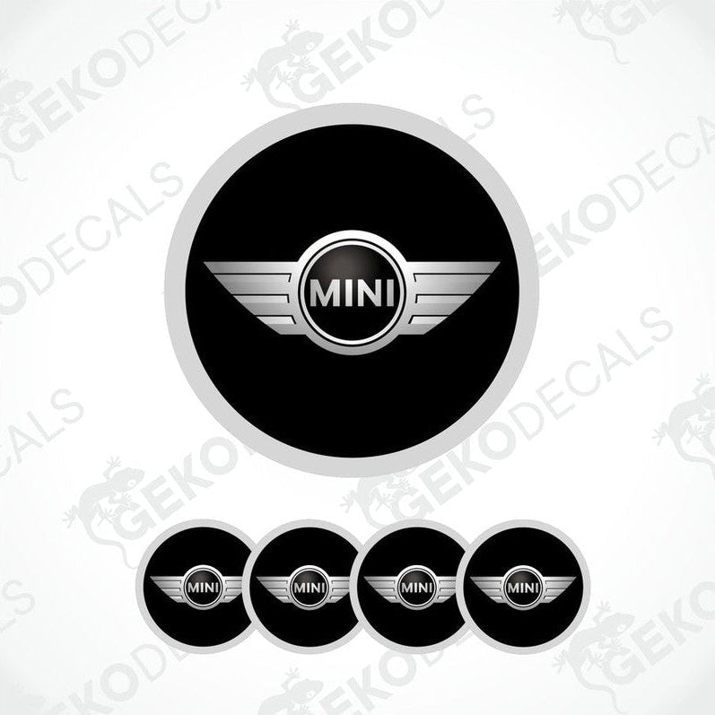 A set of four black vinyl stickers with the word 'MINI COOPR' in the center, designed to be applied on car wheels.