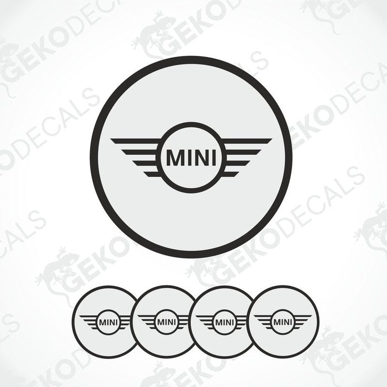 A set of round car decals for a MINI COOPER, with one large decal featuring the MINI logo and three smaller ones for wheels.