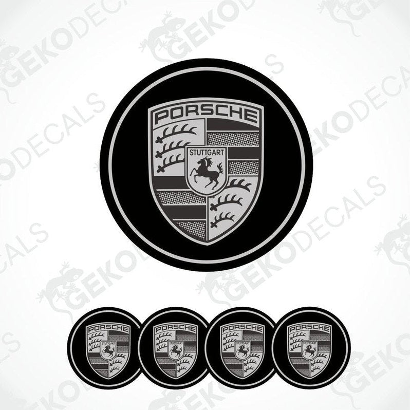 A set of four black and grey Porsche car wheel decals.