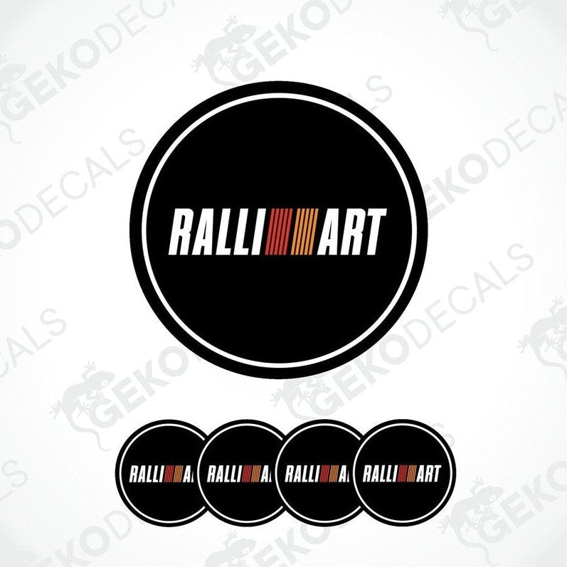 A set of four black vinyl stickers with the word 'RALLIART' and a geometric pattern in orange and red above the text.