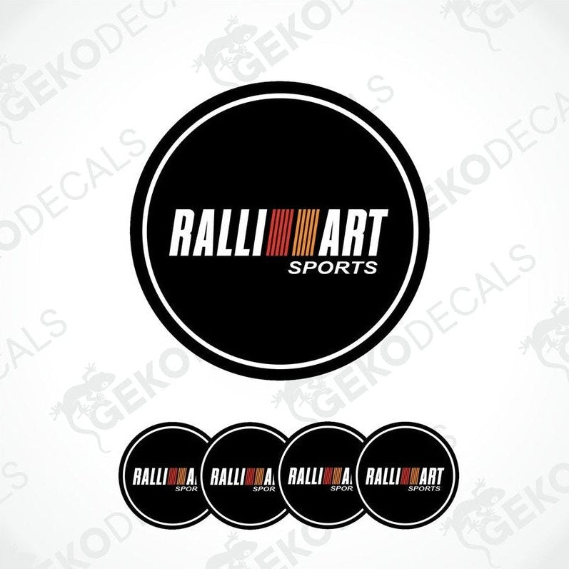 A set of four black round car decals with the 'RALLIART SPORTS' logo in white and red.