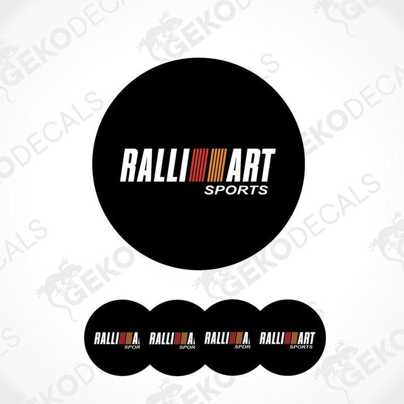 A set of four black round car decals with the 'RALLIART SPORTS' logo in white and red.
