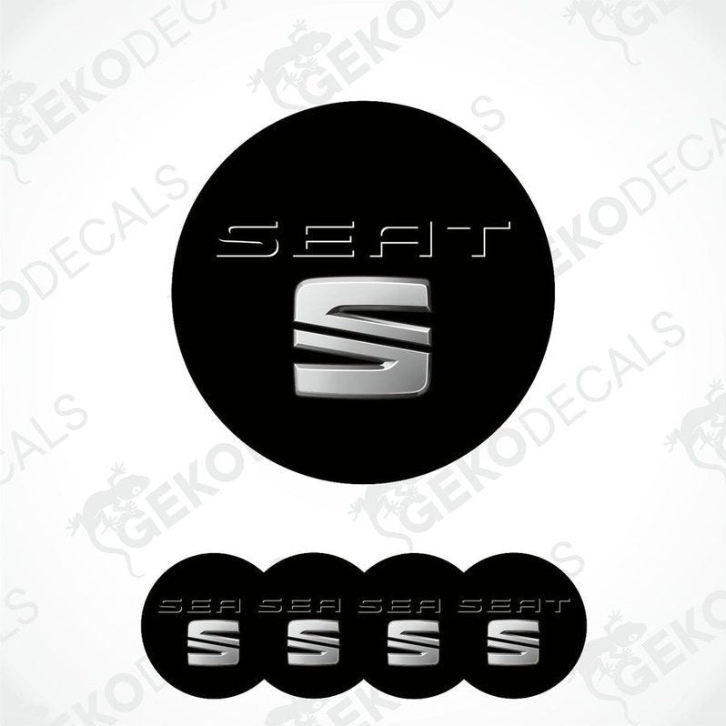 A set of four black vinyl decals with the SEAT logo in white, intended for use as car wheel caps.