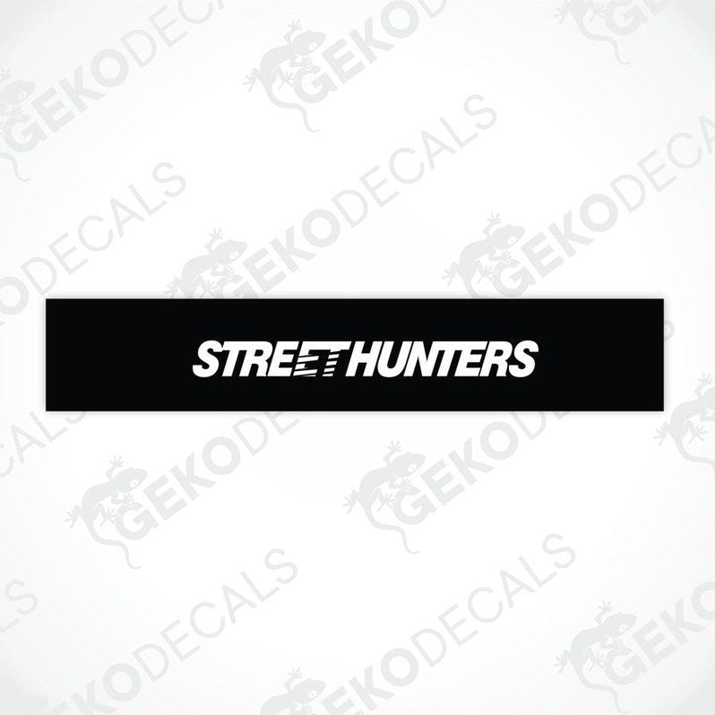 Black car windshield sun visor with white text STREETHUNTERS