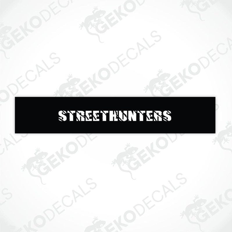 Black car windshield sun visor with white text STREETHUNTERS