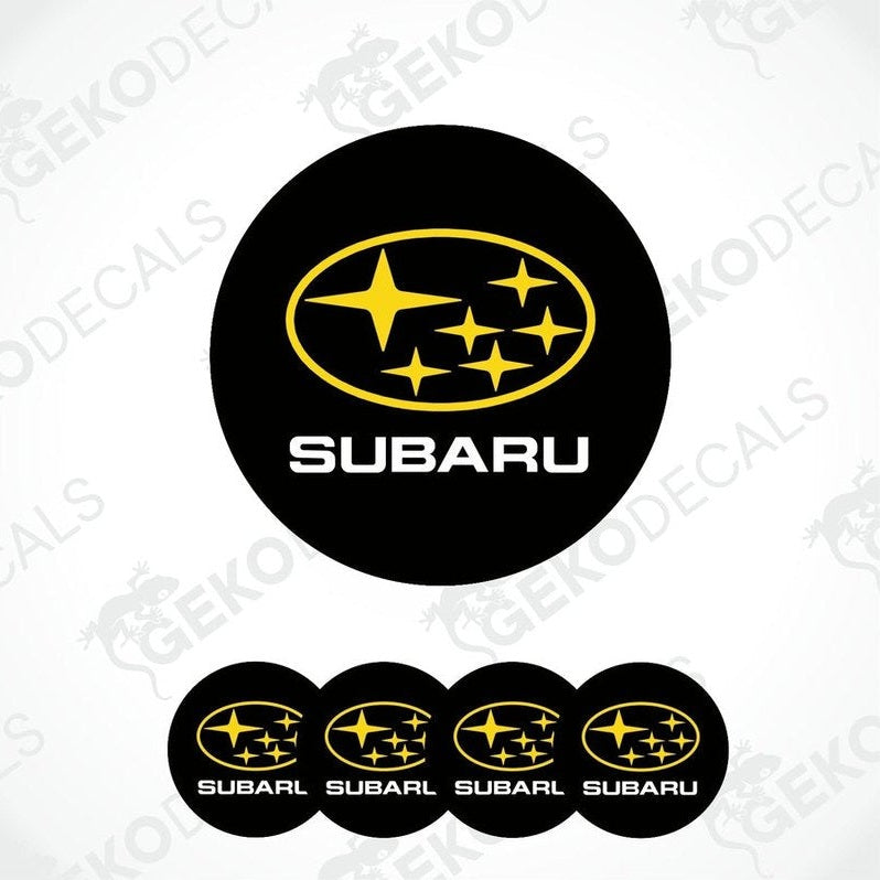 A set of four black vinyl stickers with the SUBARU brand logo and stars in yellow.