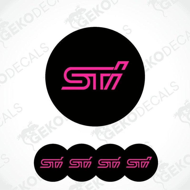 A set of four black vinyl stickers with the word ' SUBARU STI' in pink, intended for use on vehicle wheels.
