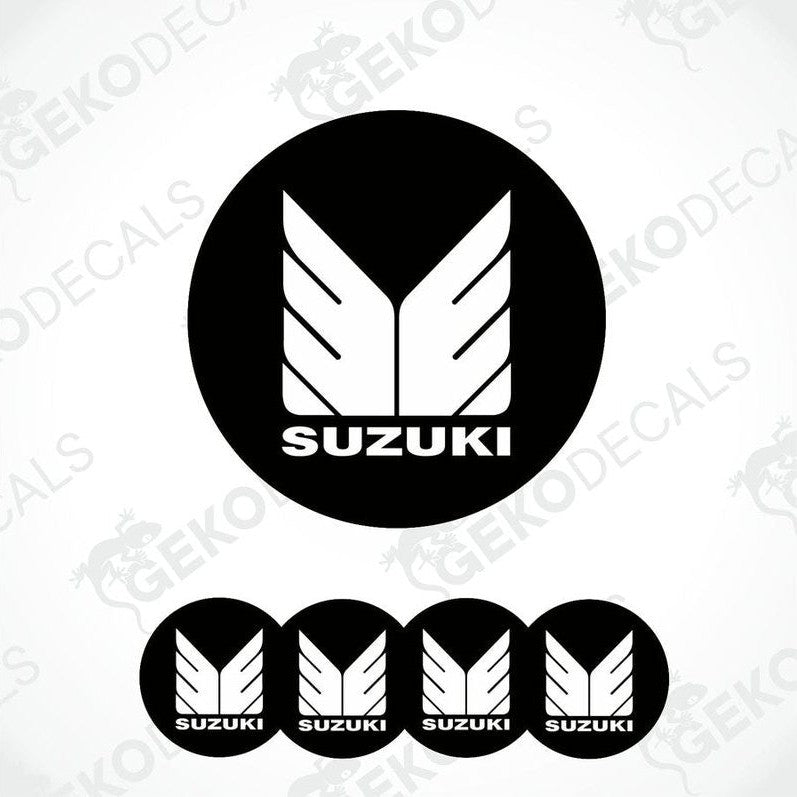A set of four black vinyl stickers with the SUZUKI brand logo design.