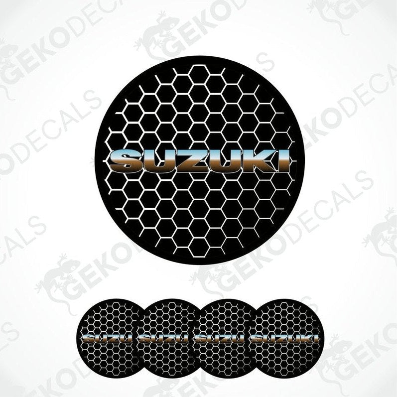 A set of vinyl decals with a polyurethane coating, featuring the Suzuki logo and a hexagonal pattern in black, silver, and gray colors.