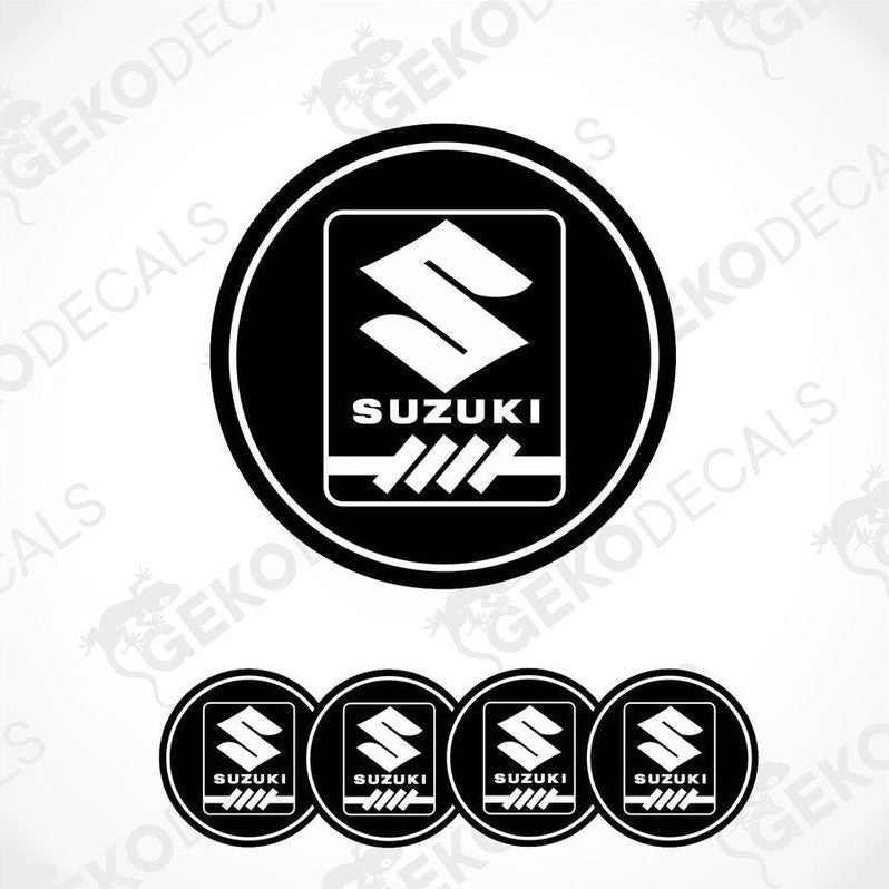 A set of four black vinyl stickers with the SUZUKI brand logo.