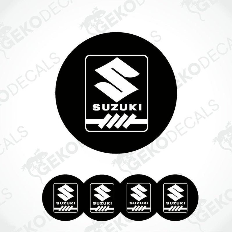 A set of four black round decals with the white Suzuki logo in the center.