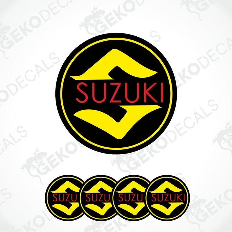 A set of four circular vinyl decals with the SUZUKI logo in black, yellow, and red colors.
