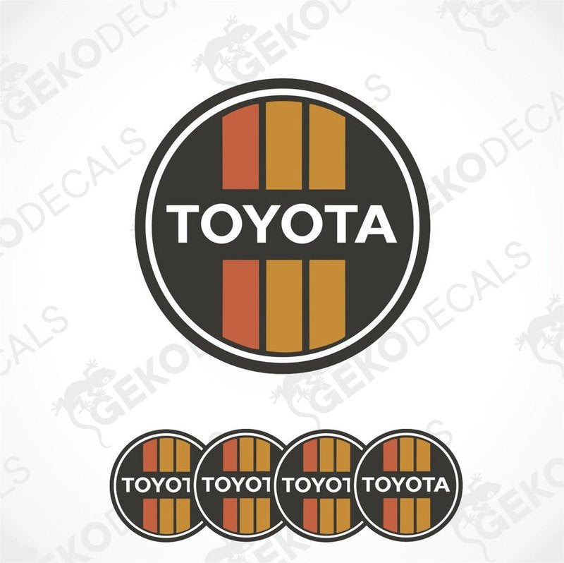 A set of four black, red, and white vinyl stickers with the letters 'TOYOTA' in the center.