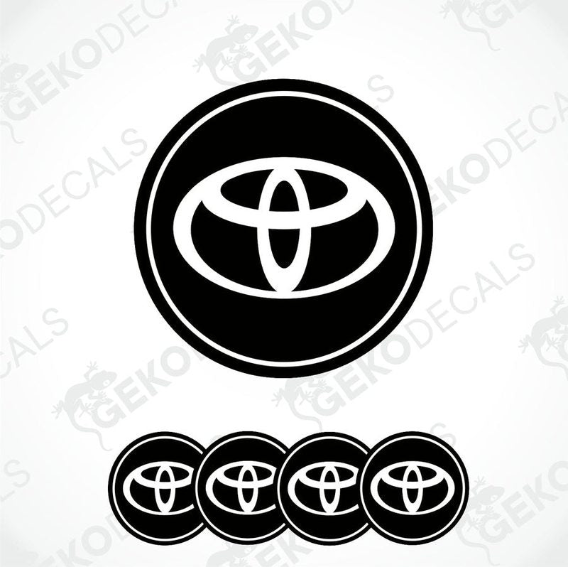 A set of four round car decals with the Toyota logo in black and white.