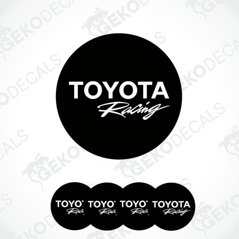 A set of four black vinyl stickers with the TOYOTA RACING logo, designed for use on car wheels or caps.