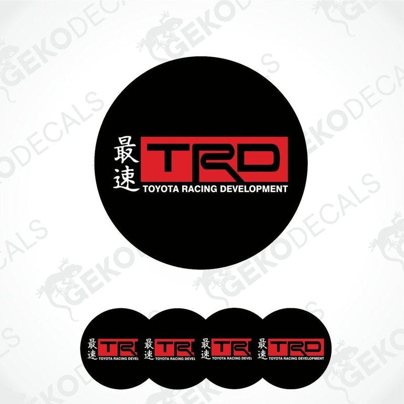 A set of black round car decals with the Toyota Racing Development (TRD) logo in red and white.