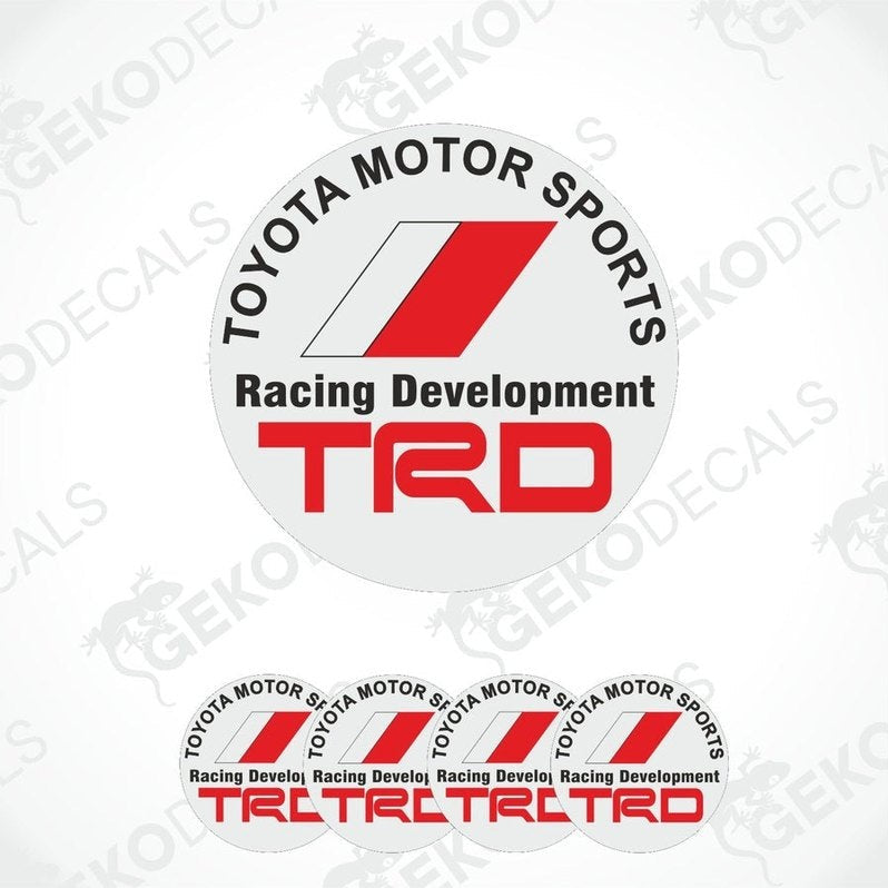 A set of four white vinyl stickers with red and gray Toyota Racing Development (TRD) branding, designed for use on vehicle wheels or caps.