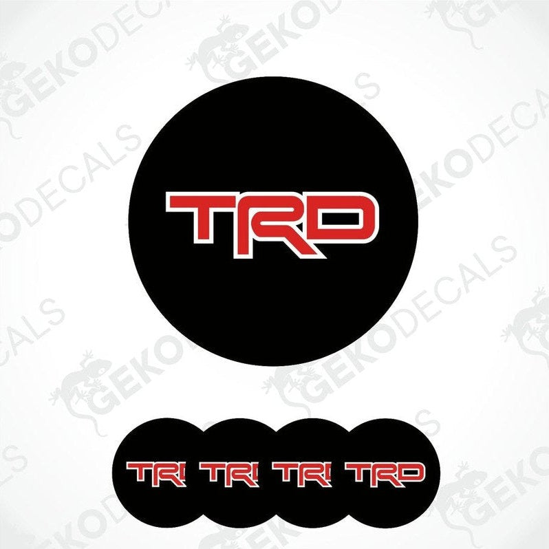A set of four black vinyl decals with red 'TRD' logo, designed for use as car wheel stickers.