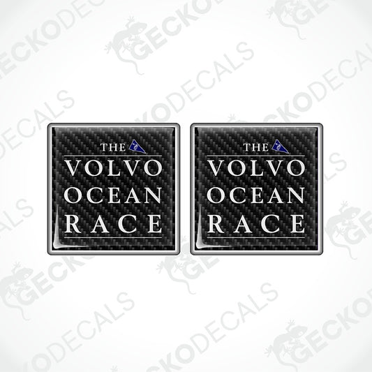 Two square black carbon-fiber-style decals with the text 'THE VOLVO OCEAN RACE' in white and a small blue triangle logo, shown on a light gray background with repeated watermark text.