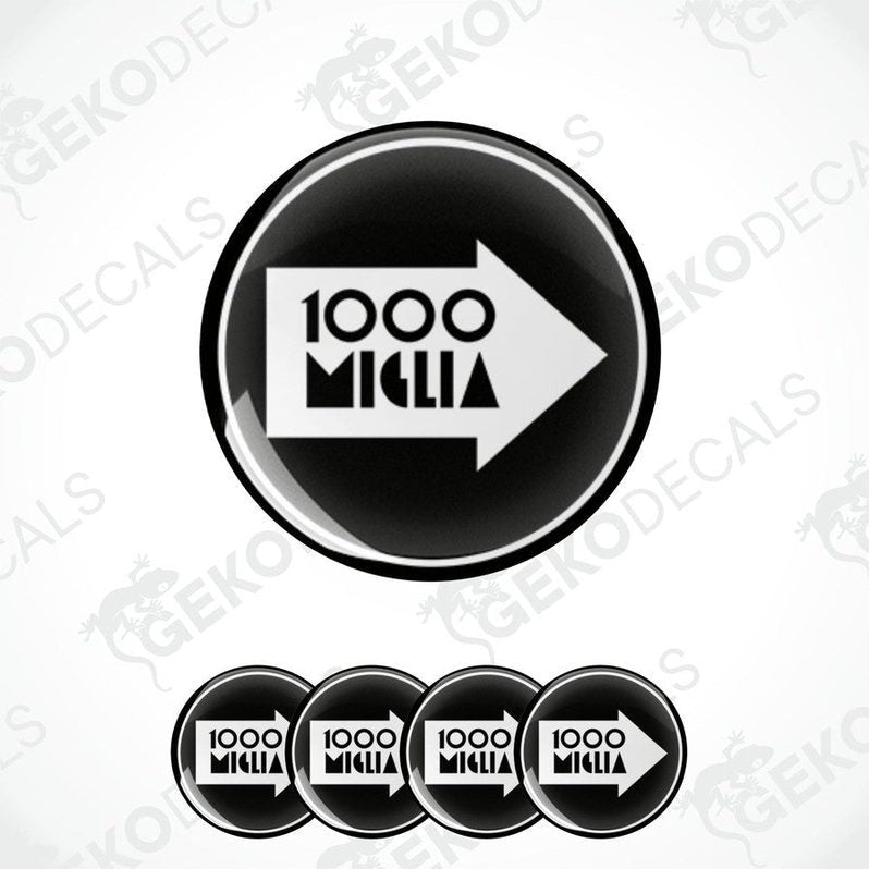 A set of four black vinyl stickers with the text '1000 MIGLIA' and an arrow symbol in the center.