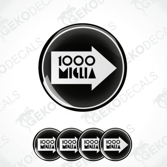 A set of four black vinyl stickers with the text '1000 MIGLIA' and an arrow symbol in the center.