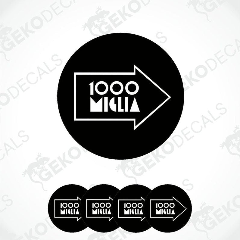 A set of black vinyl decals with the text '1000 MIGLIA' in white. The decals are designed to be applied on a surface, likely car wheels, to serve as decorative stickers.