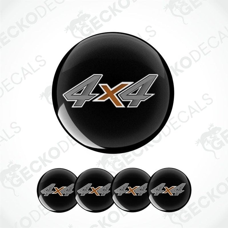 Black wheel cover with '4x4' logo on a white background