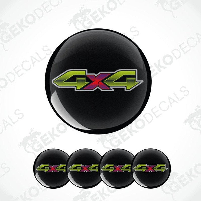 Black wheel cover with colorful '4x4' logo on a white background