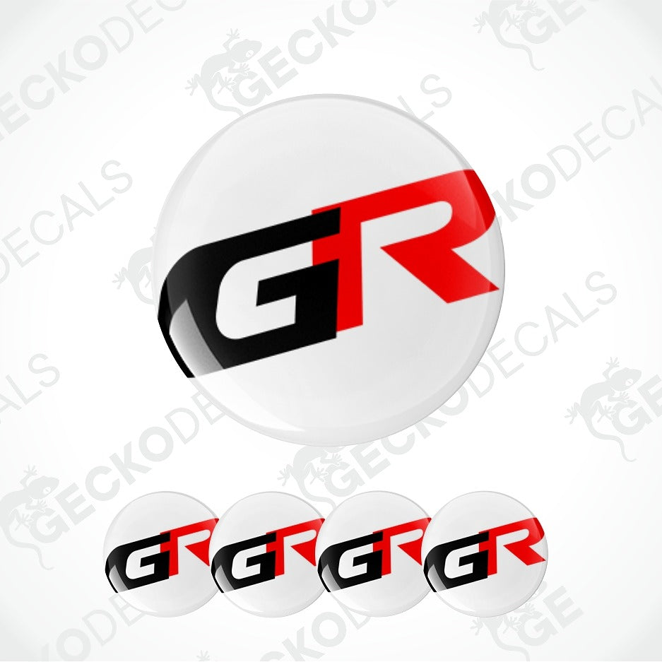 A glossy round decal or badge featuring the stylized letters 'GR' in black and red on a white circular background, shown with four smaller identical badges along the bottom on a light gray background with faint Geckodec watermark text.