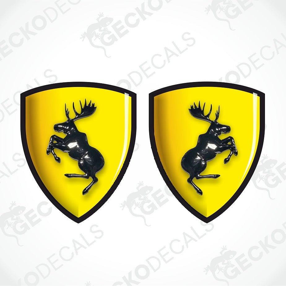 Two identical yellow Ferrari shield decals with black borders and a black prancing horse, shown side by side on a white background with a faint diagonal watermark.