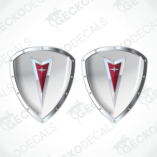 Two identical metallic silver shield-shaped decals with a red chevron and white star emblem in the center, shown on a light gray background with a faint repeating watermark.
