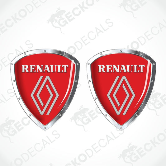 Two identical red shield-shaped Renault decals with silver metallic borders and the white Renault logo and wordmark, shown on a light gray background with faint watermark text.
