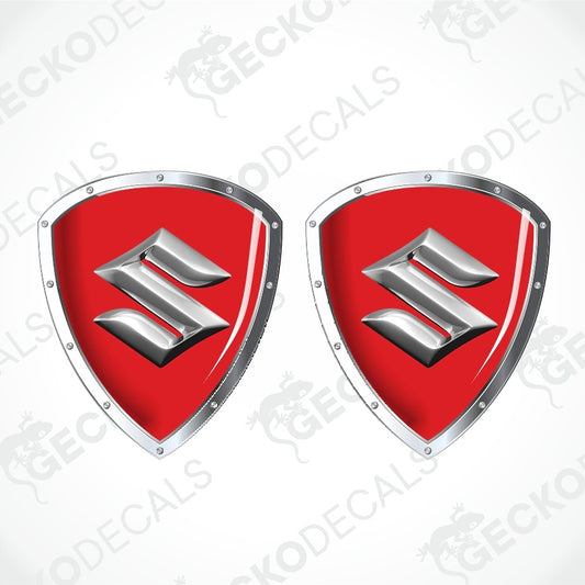 Two identical shield-shaped decals with a red center and a silver metallic stylized 'S' emblem, shown on a light gray background with diagonal watermark text.