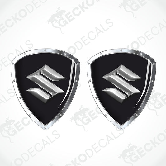 Two identical shield-shaped decals with a black center and a silver metallic stylized 'S' emblem, shown on a light gray background with diagonal watermark text.