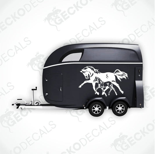 A black trailer with a die cut decal of a horse and a son on the side.
