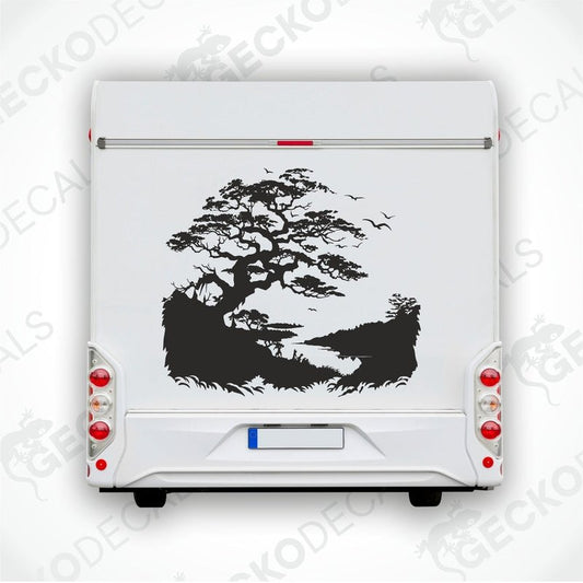 A black and white die cut sticker of a tree on the banks of a stream, applied to the side of a white car.