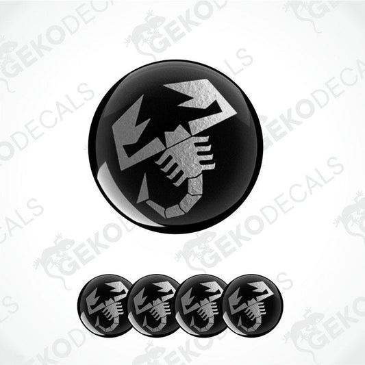 Black and silver decal with a scorpion design on a white background