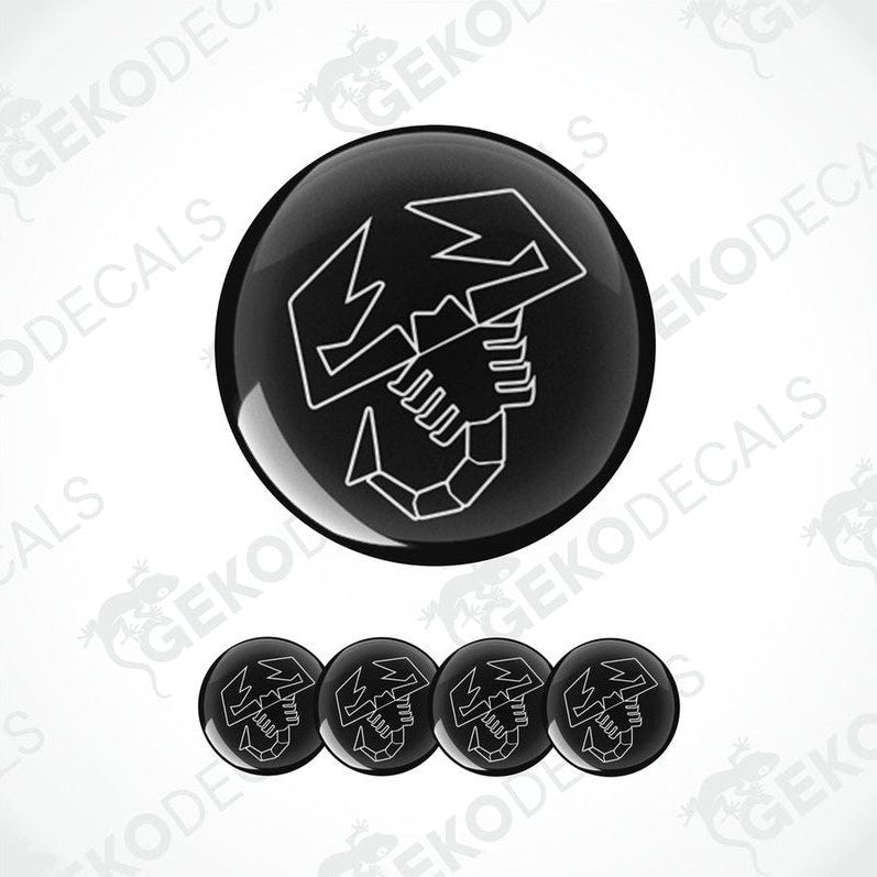 A set of four black and white vinyl decals with a polyurethane coating, featuring a car logo, displayed on a white background.
