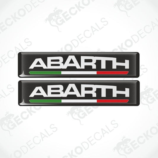 Two vinyl decals with polyurethane coating featuring the word 'ABARTH' with an Italian flag color stripe.