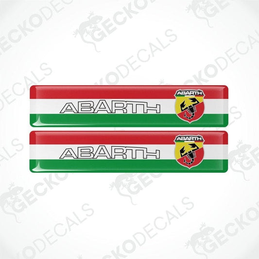Two vinyl decals with a polyurethane coating featuring the Abarth logo and the colors red, white, and green.