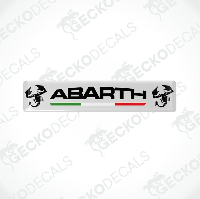 White vinyl decals with 'ABARTH' branding and Italian flag colors visible through the clear dome part.
