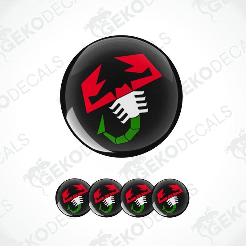 A set of four round car decals featuring a red and green scorpion logo on a black background.