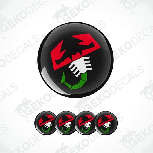A set of four round car decals featuring a red and green scorpion logo on a black background.