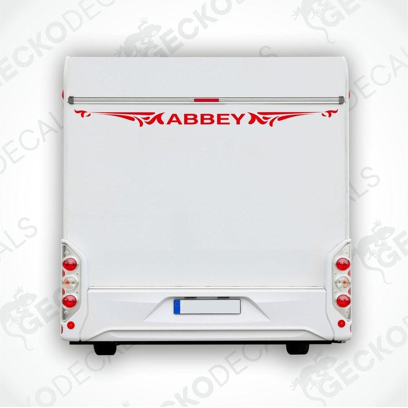 Red Abbey caravan rear decal with ornamental flourishes applied to white trailer