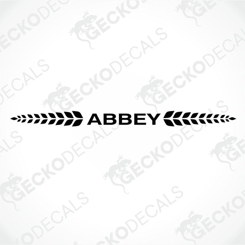Black Abbey caravan die-cut sticker with leafy wreath design on white background