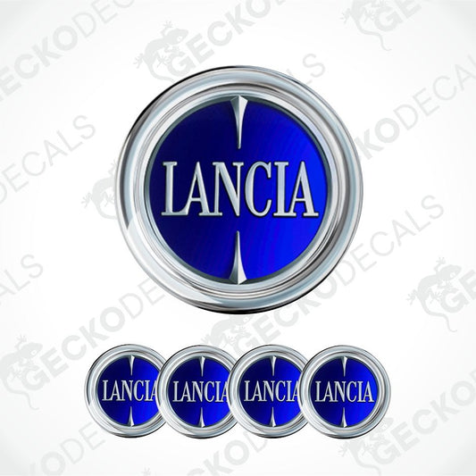 A set of Lancia oval decal stickers, featuring one large decal at the top and four smaller ones aligned horizontally at the bottom. The decal design has a metallic silver chrome border surrounding a deep blue center with the brand name 'LANCIA' in white serif lettering.